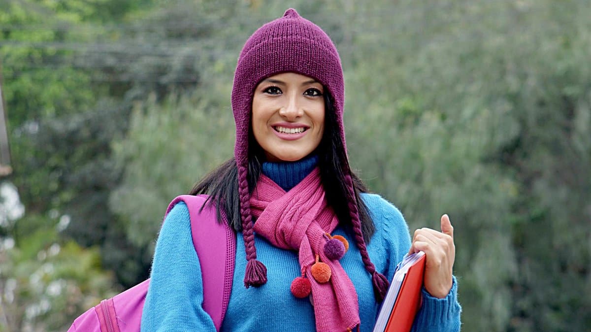 Student with Canadian flag on university campus